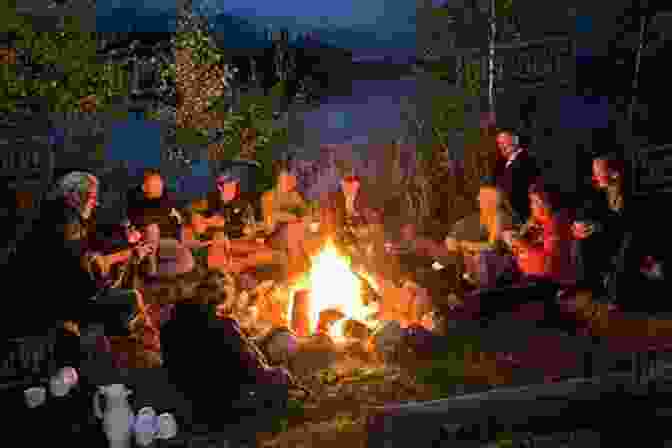 A Group Of People Gathered Around A Campfire, Symbolizing The Power Of Connection And Community. The Lincoln Highway: A Novel